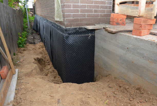Happy homeowners after waterproofing job in Harpster